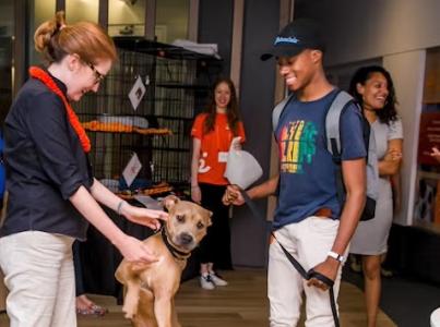Smiling group around a dog