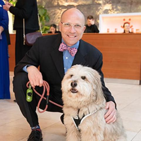 Micarl “Mica” Hill with medium white fluffy dog