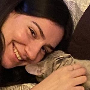 A person and cat relaxing together