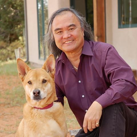 Steven Hirano with large brown dog