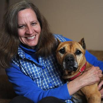 Amy hugging her adopted dog Georgia