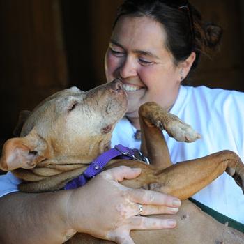 Best holding Little Red dog like a baby