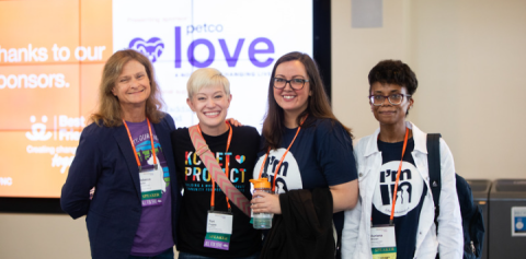 Four attendees to the 2022 Best Friends National Conference pose for a photo